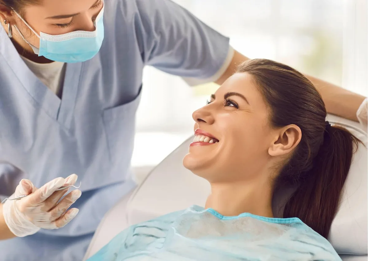 Patient smiling during an orthodontic consultation about whether clear braces are worth it.