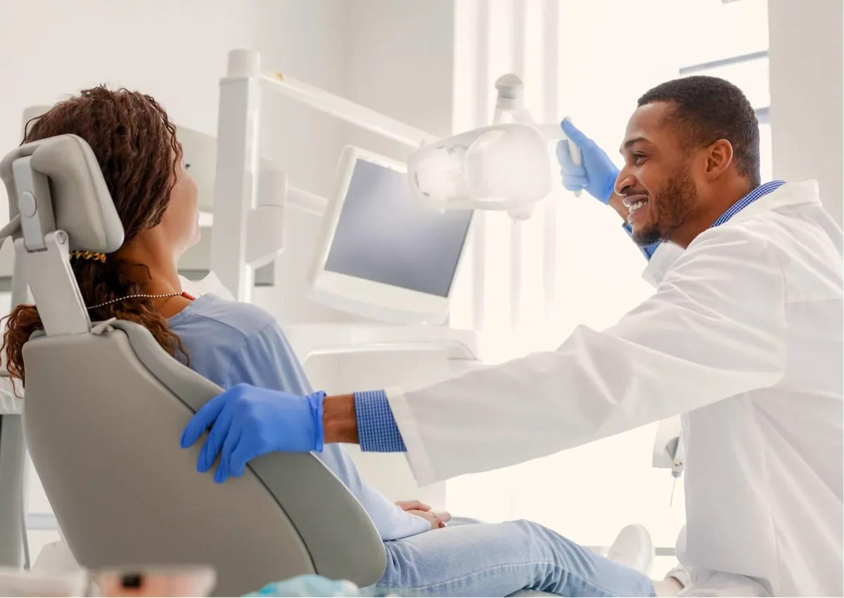 Dentist discussing crossbite correction options with a patient during an orthodontic consultation.