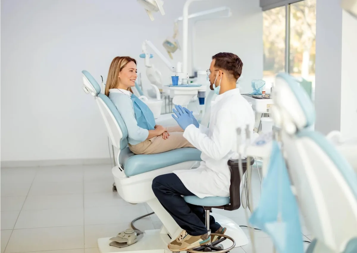 Patient discussing braces costs and insurance coverage with an orthodontist during a consultation.