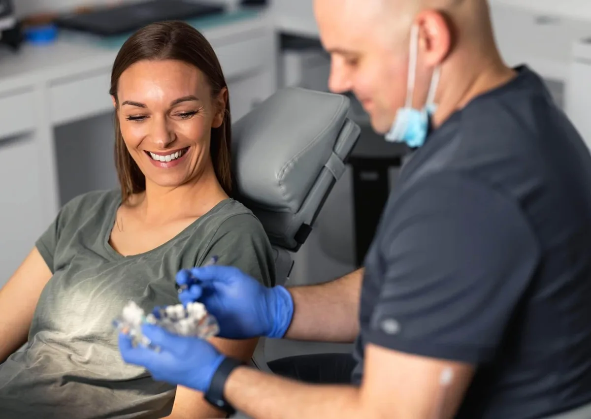 Adult patient discussing braces cost and orthodontic treatment options with a dental professional.